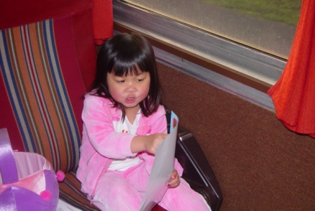 Kasen reading on the train